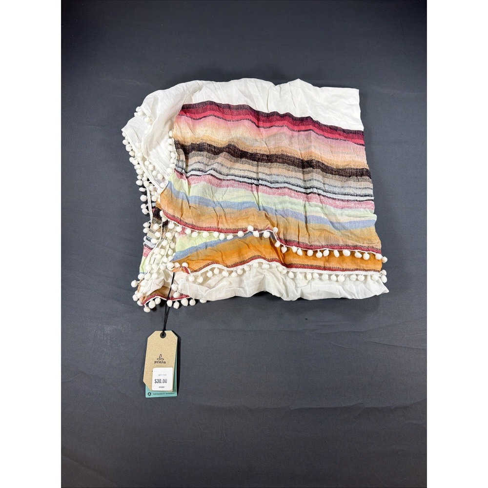lightweight, multicolored striped scarf or wrap featuring white pom-pom Prana